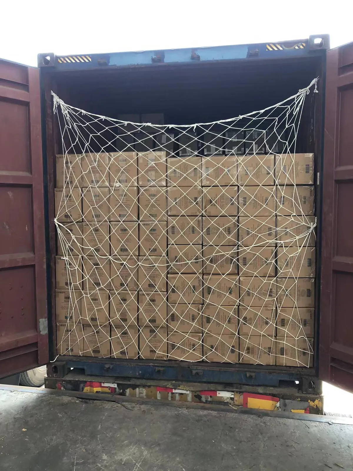 Fig 2: Container interior after loading — nested cartons stacked to near-full cube with dunnage between columns
