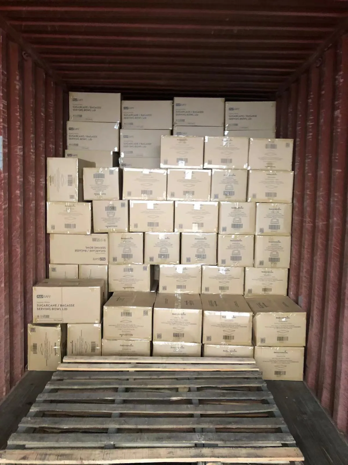 Fig 1: Plastic box cartons staged for loading at Yantian — nested box SKUs segregated for the cube plan