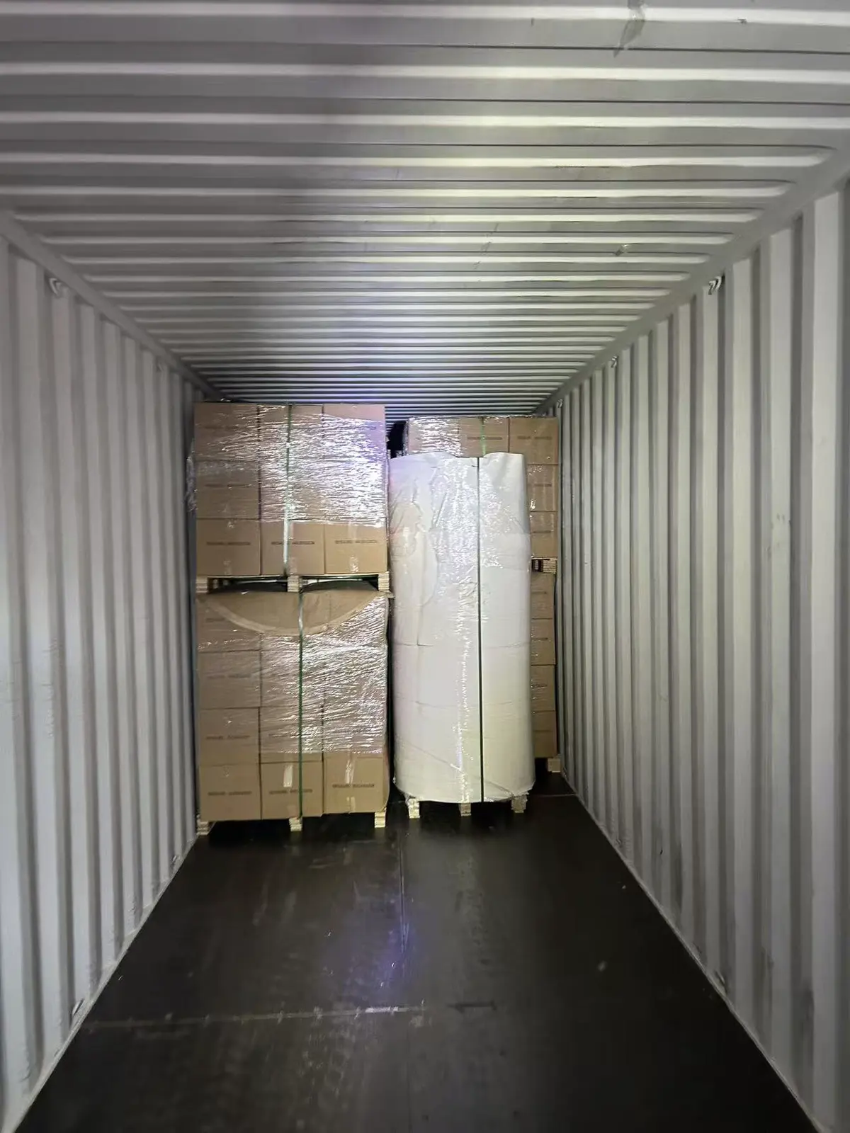 Fig 1: Paper cup fan cartons staged at the Qingdao consolidation warehouse for LCL loading