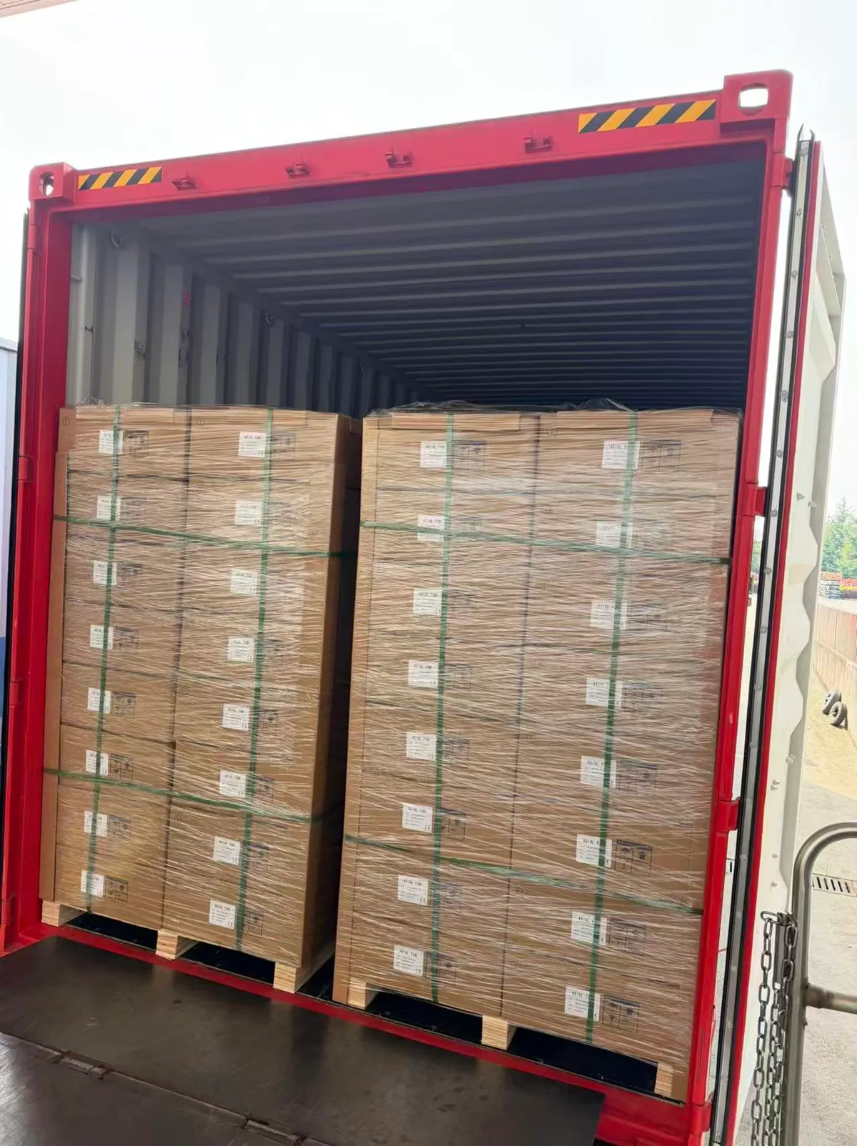 Fig 1: LED light cartons loaded in the 40HQ at Shanghai — foam-lined cartons for the glass-tube products visible in the stack