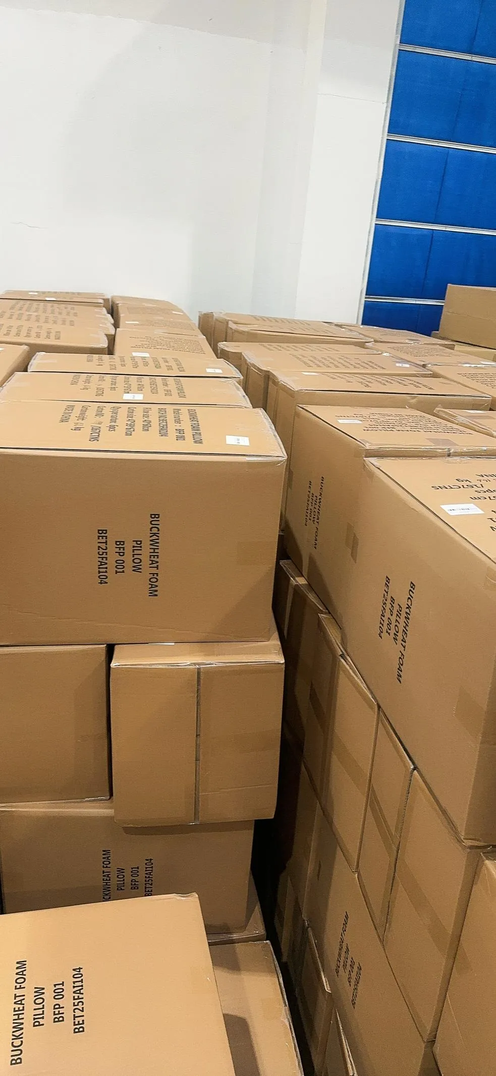 Fig 2: Pillow pallets shrink-wrapped at the Yiwu warehouse — palletized for stable LCL handling