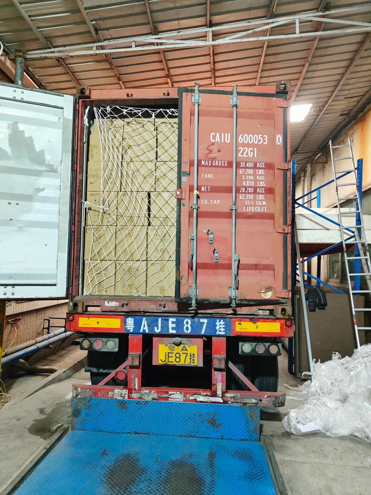 Fig 1: Soap dispenser cartons staged for loading at the Nansha consolidation point — mixed wall-mounted and countertop models