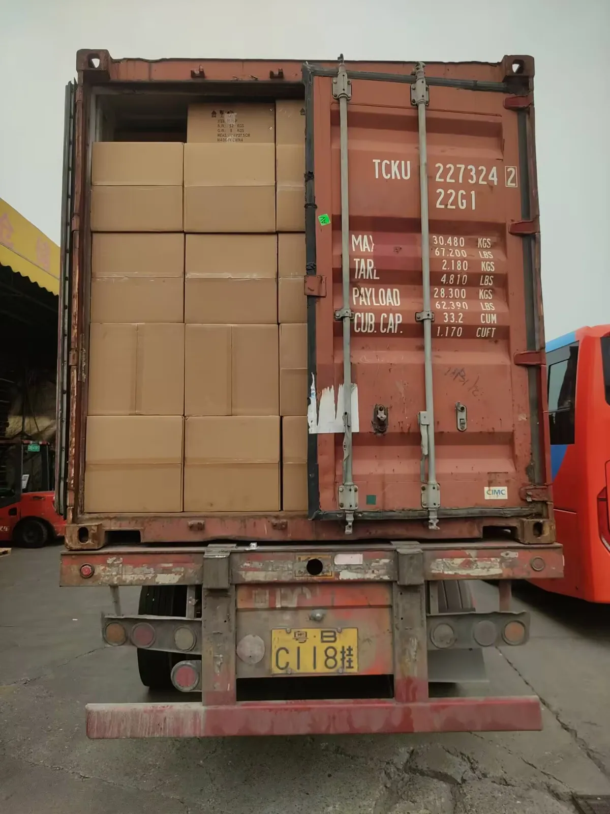 Fig 2: Palletized cartons shrink-wrapped with corner boards before container loading — stacking limited to two pallet heights