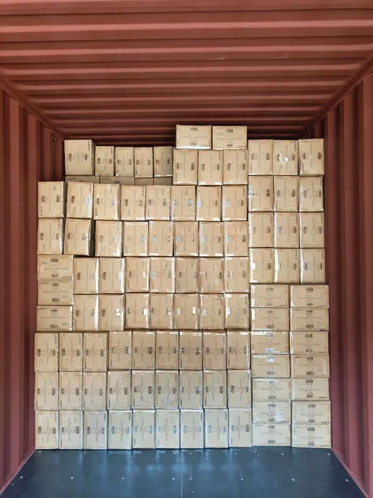 Fig 2: Palletized cartons after shrink-wrapping — lids flat-packed on the base layer with nested box bodies above