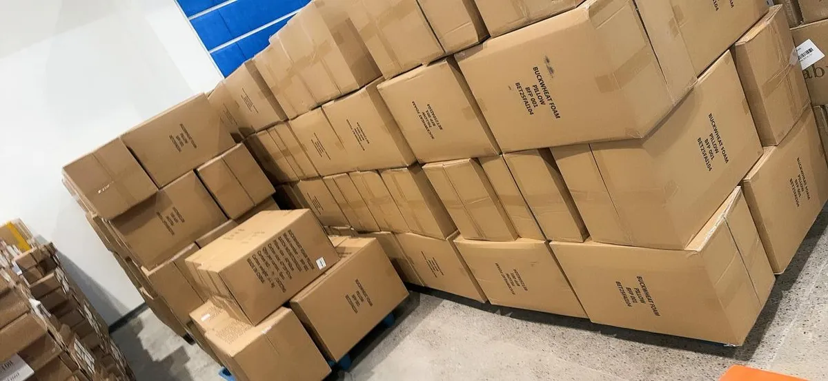 Fig 1: Buckwheat foam pillow cartons on pallets at the consolidation warehouse in Yiwu before departure