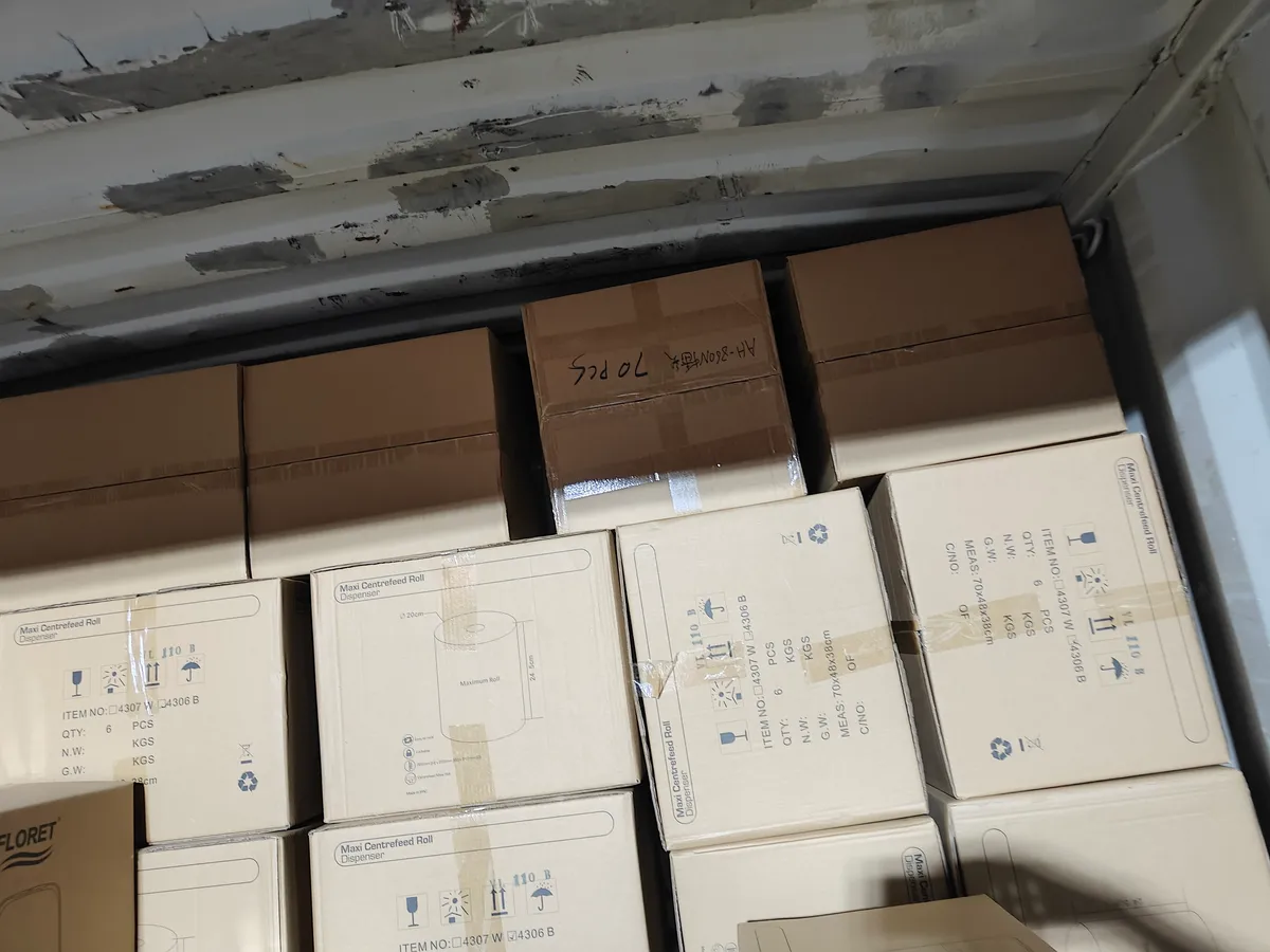 Fig 2: Interior of the 40HQ during loading — wall-mounted dispenser cartons interlocked to prevent load shift